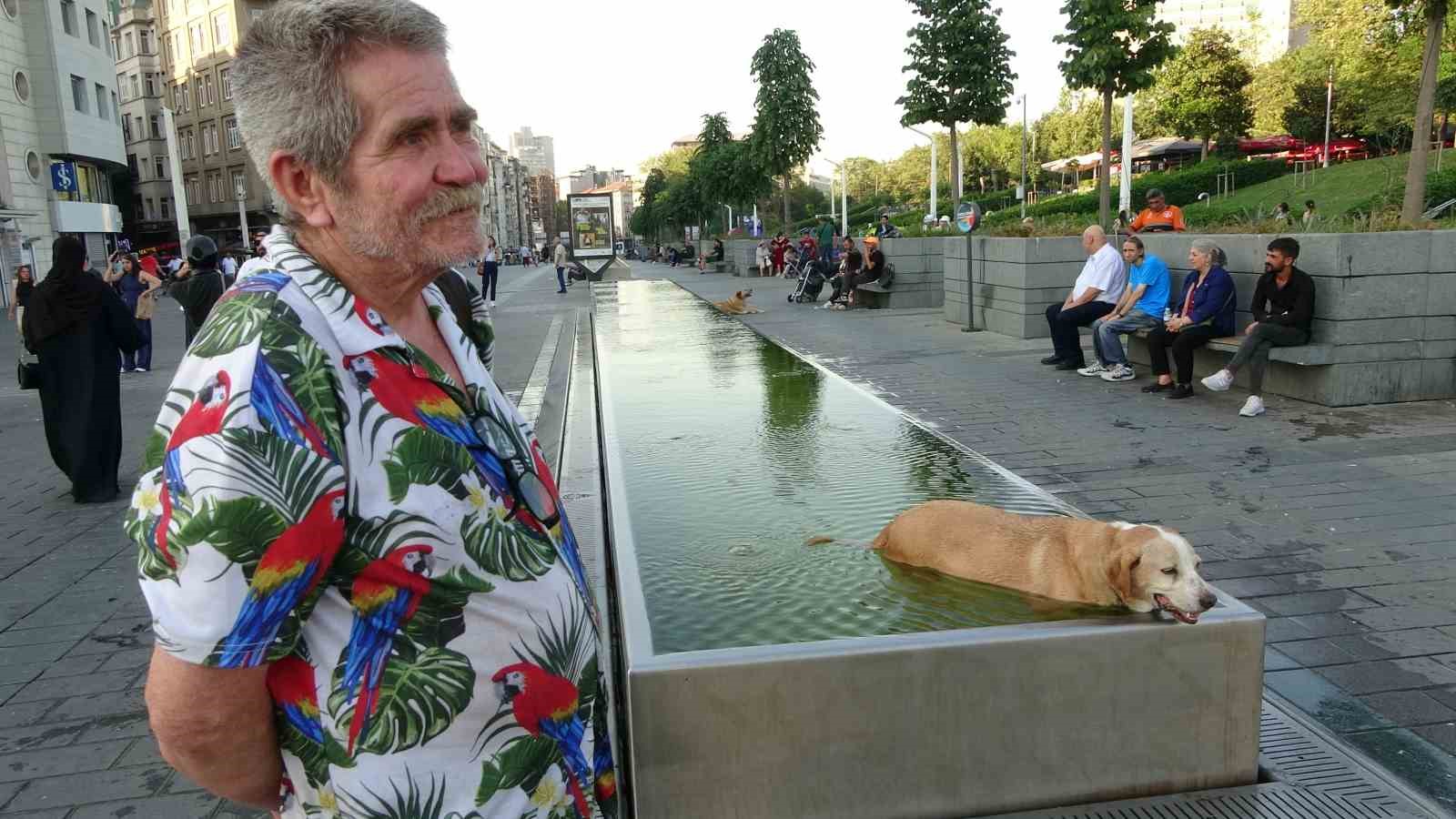 Taksim’de sıcak havadan bunalan çocuk ve köpek süs havuzunda serinledi 